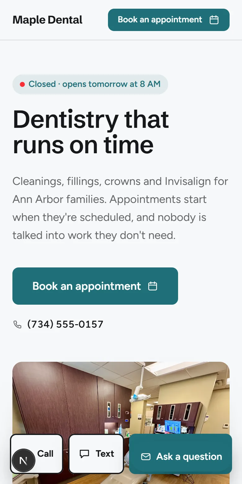 A sample dentist website on a phone
